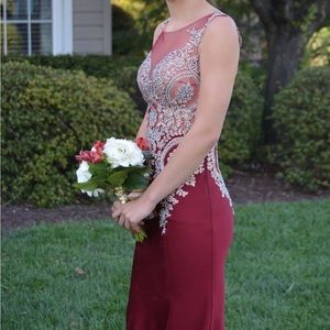 Maroon prom dress worn once. Had cups put in. No alterations at the bottom.